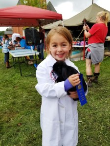 4-H member Eleanor holds her bunny as she exhibits at the 2019 Athens Fair.